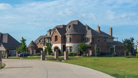 A large brick house on a culdesac in Lucas, TX.