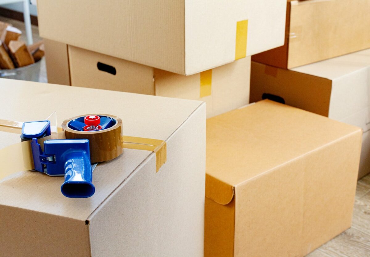 A storage unit packed with taped boxes sits ready to be organized.