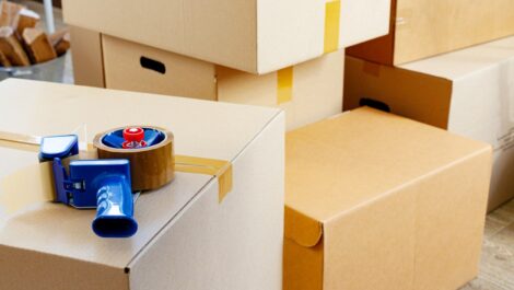 A storage unit packed with taped boxes sits ready to be organized.