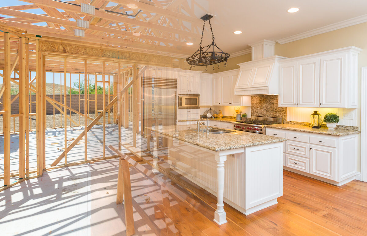 A mid-construction home, showing the house’s framing as it progresses into a finished kitchen.